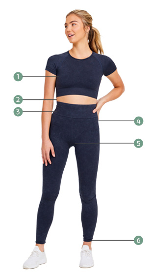 woman wearing a navy activewear croptop and matching navy activewear leggings with sneakers